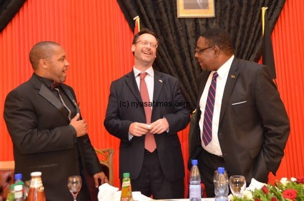 President Peter Mutharika, British High Commissioner to Malawi Michael Nevin and Vice President Chilima share a light moment 