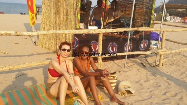 Patrons chillaxing on the shores of Lake Malawi during the festival
