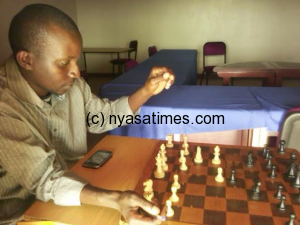 Local chess player Chingati thinking about his next move