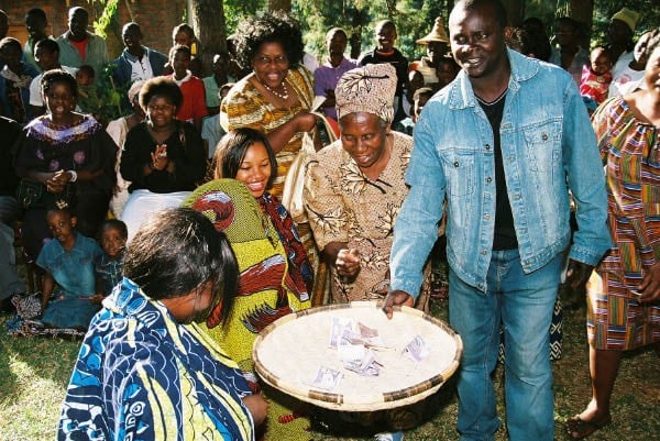 At a traditional Malawian engagement (chinkhoswe) the guests give many low denomination notes in a dance (pelekani pelekani)
