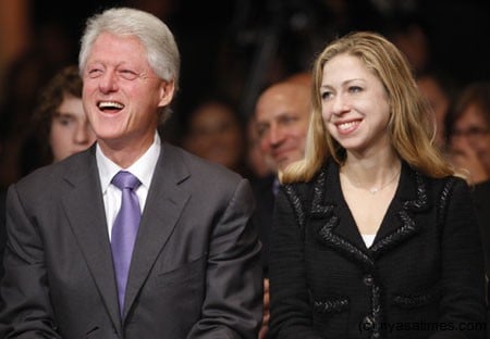 Former U.S. President Bill Clinton (L) and his daughter Chelsea 