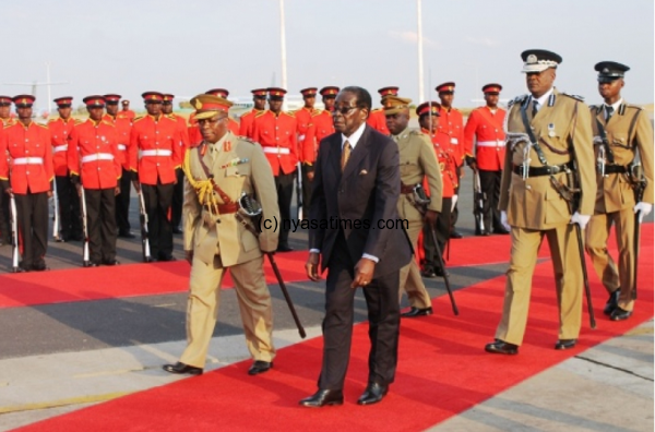 President Mugabe Inspects a guard of honour - Pic by Abel Ikiloni