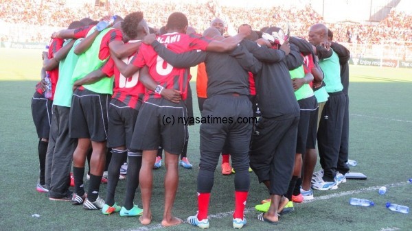 Thanks giving prayers: Malawi players after the game.-Photo by Jeromy Kadewere, Nyasa Times