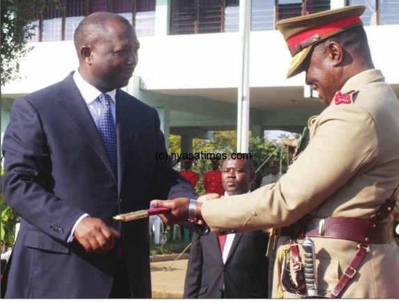 Despitie handing over over sword of command to General Maulana, Henry Odillo is still on pay roll while at home