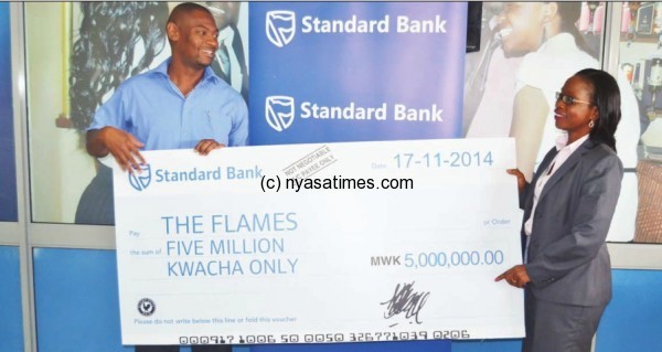 Nyamilandu receiving the standard Bank cheque from Chanza