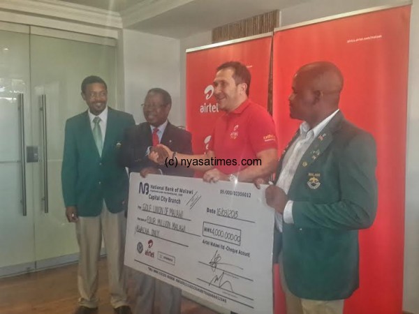  Airtel MD handing over the cheque to executive members of the Golf Union of Malawi and National Team Members