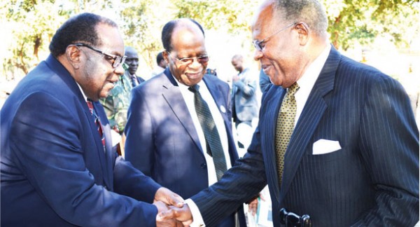 Finance Minister Goodall Gondwe greets former presidet Bakili Muluzi at the Kamuzu memorial