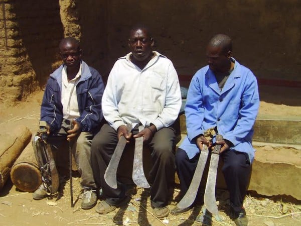 illage headman Chisuka and his elders display pangas used  by unknown Gulewamkulu - pic by LINA