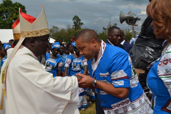 Malawi Vice President Saulos Chilima greeting His grace Bishop Tambala