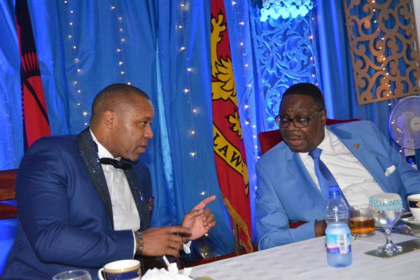 President Mutharika have a talk with Vice President Saulos Chilima at the DPP blue night