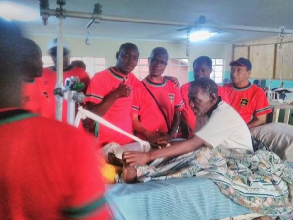 Mwase and other coaches cheering Masanjala in hospital