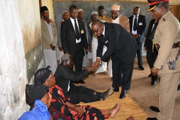 Mutharika consoling the bereaved family