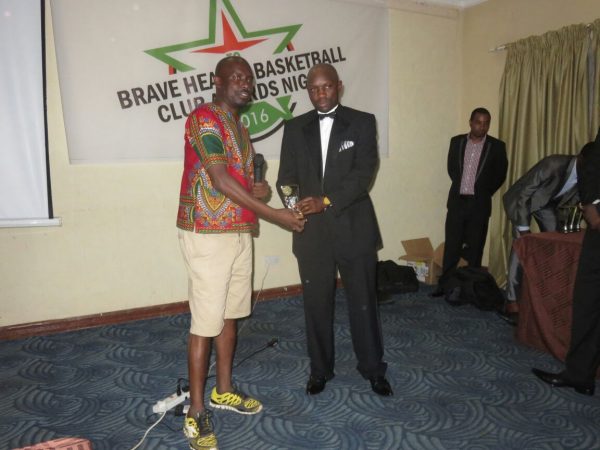 Champion of the game Jere (in suit) gets his award