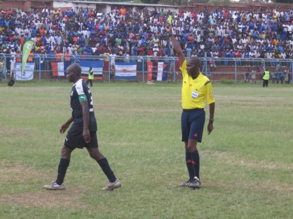 Lengani books Eagles defender Steve Chagoma for a foul, Pic Alex Mwazalumo