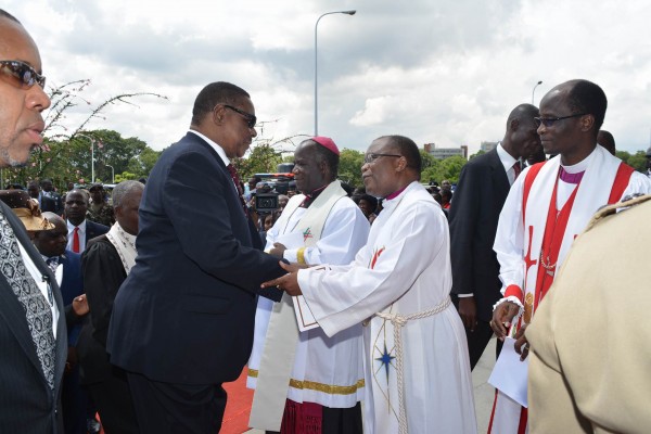 Mutharika greeting bishop Bvumbwe and other clergy
