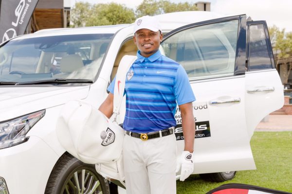 Bushiri stading on a Lexus car which was given to the winner of the chairty golf