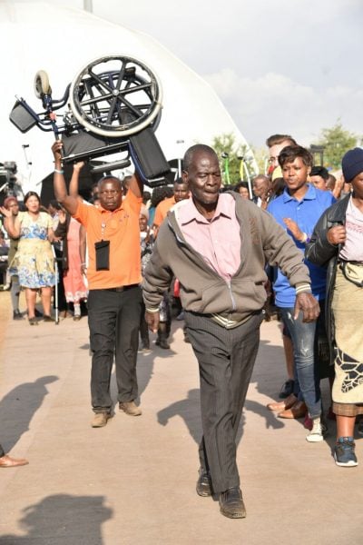 A man healed from wheel chair and walks about