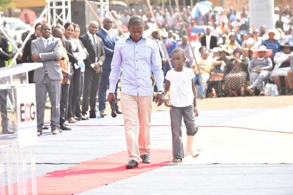 Bushier with a child he had prayed for