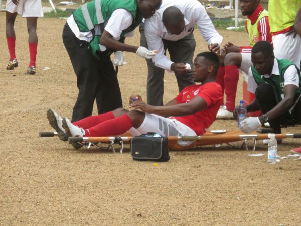 Lanjesi receiving first aid treatment after sustaining a cut, Pic Alex Mwazalumo