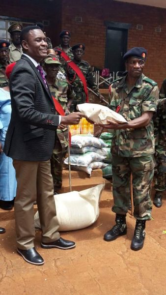 Chisale presenting the donatio to retired soldiers on behalf of President Mutharika