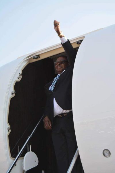 Mutharika back and waves with left hand and right hand seems unwell