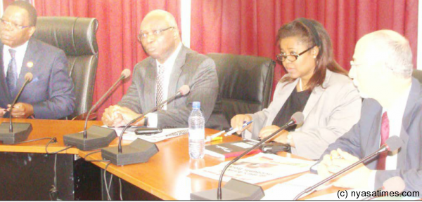 Minister of Finance Lipenga , Tsikata, IMF resident rep for Malawi Ruby Randall during the news conference