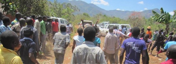 Angry people chasing away Information Minister Jappie Mhango at the funeral of former MP Tasokwa Msika in Rumphi.