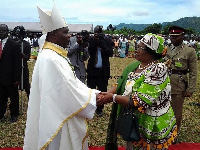President Banda congratulating Bishop Stima