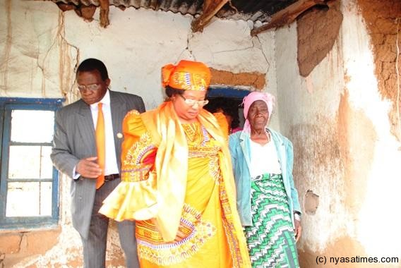 President Banda at Goliyo in Ndirande in a dilapidated house of an elderly. She will build a new good house for her