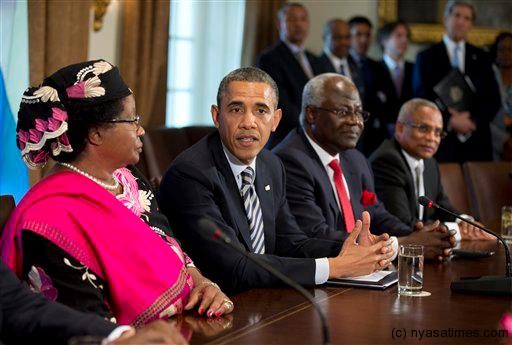 President Barack Obama speaks in the Cabinet Room of the White House in Washington, Thursday, March 28, 2013, after a meeting with, from left, Malawi President Joyce Banda; Sierra Leone President Ernest Bai Koroma; and Cape Verde Prime Minister José Maria Pereira Neves . (AP Photo/Manuel Balce Ceneta)