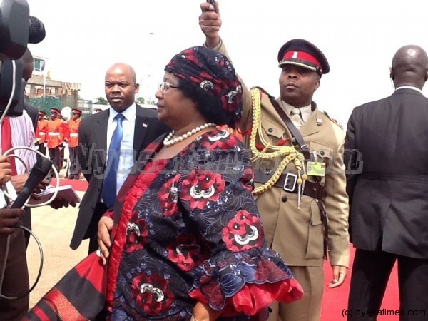 President Banda addressing journalists before departure