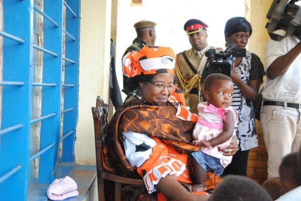 President Banda with  a baby in Mwanza