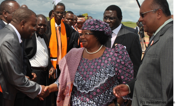 Banda bids farewell to party officials before departure at Chileka International airport in Blantyre.-Photo by Francis Mphweya