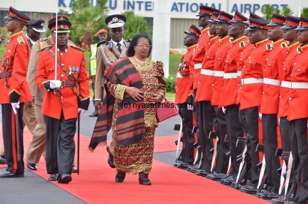 President Banda inspecting a guard of honour before departure