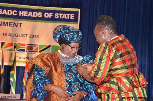 President Banda receiving her SADC badge