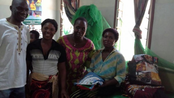 Kabwira treating mothers with gifts at Khombedza