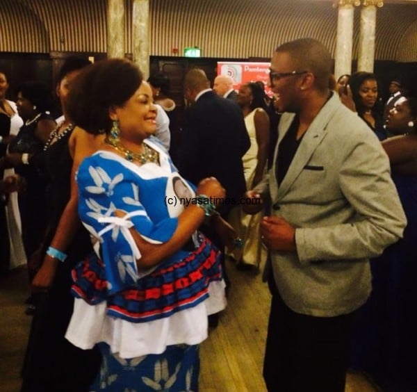 Dancing time: Kaliati joined by Nyasa Times editorial director Thom Chiumia on dance floor