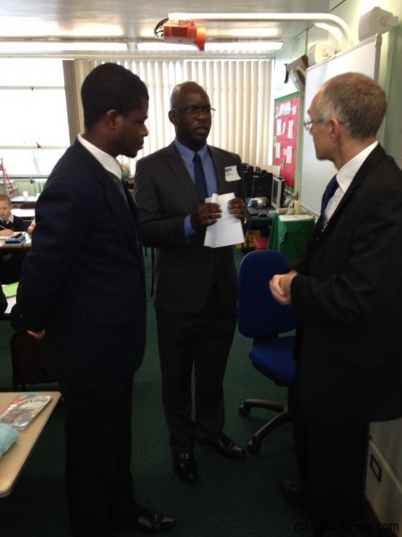 Kasakula and another student being briefed by class teacher 