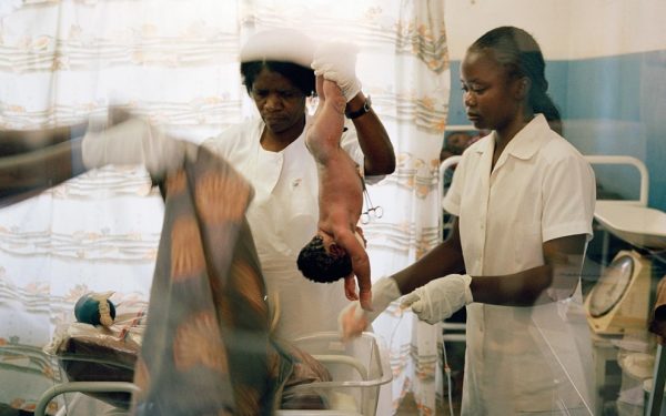 Malawian midwife Rustica Banda, attending to a newborn baby in need of resuscitation at Mitundu Community Hospital near Lilongwe in 2005. This under-resourced rural hospital delivers 10 to 13 babies a day.Gideon Mendel / Corbis