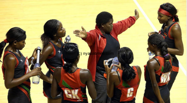 Malawi Queens coach Mary Waya giving tips to players during training