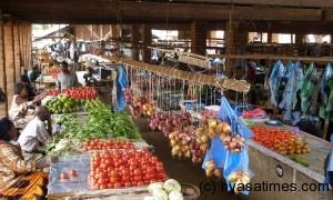 Market fee up:Produce sale at local market in Malawi
