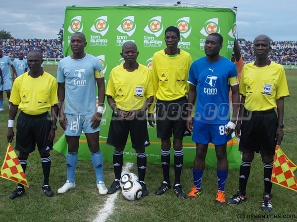 Match officials posing for Nyasa Times with skippers of Silver and Wanderers before kick-off