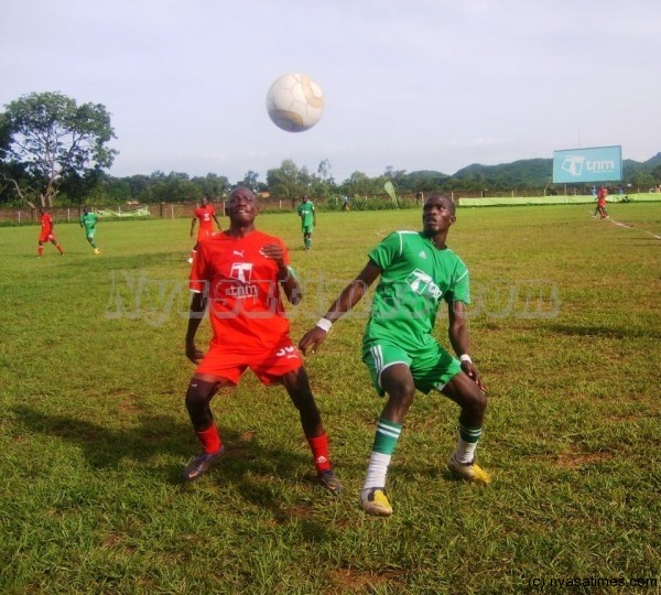 Red Lions' Benesi Kaisi (left) fights for the ball with Moyale's Gastin Simukonda during the game