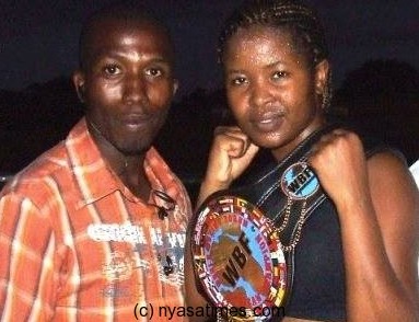 Mtimaukanena (r) posing with Nyasa Times reporter Elijah Phimbi