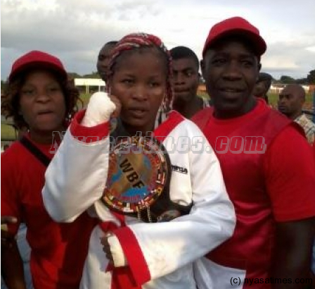 Scaling heights: Mtimaukanena pose with her WBF Africa belt after the fight - Pic by Roy Nkosi/Mana