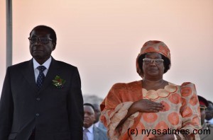 Mugabe (left) still faces US sanctions. On the left is President Joyce Banda who saved Malawi from the West aid freeze when she took over power from late Bingu wa Mutharika