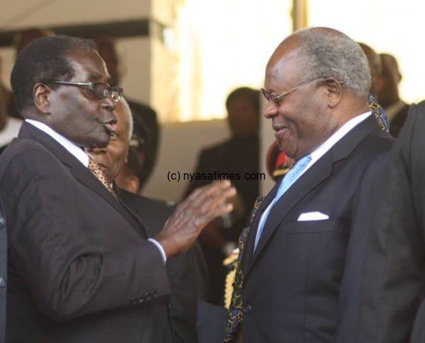 Zimbabwe President Comrade Robert Mugabe with Malawi ex-president Muluzi chatting at the celebration. Photo courtesy of Mana