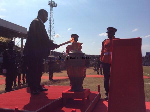 Malawi President Prof Peter Mutharika lights a torch to mark 50 years of Independence. Pic MANA