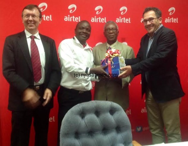 Airtel MD hands over the ZTE Tabs to the college's Librarian Professor Joseph Uta.