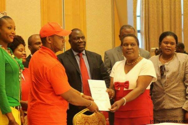 Done deal: Airtel Malawi boss with NAM boss showing the MOU